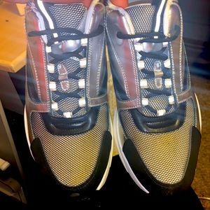 these sleek Dior B22 sneakers in silver, black, and white.